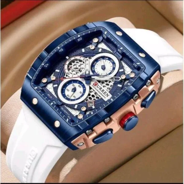 Montre Homme CURREN 8442 – Boîtier Carré Bleu Ajouré, Bracelet Silicone Blanc