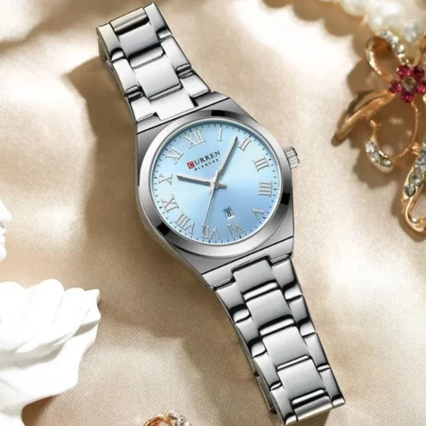 Montre Femme CURREN 9095 – Cadran Bleu Ciel Dégradé, Chiffres Romains, Tout Acier
