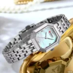 Montre Femme CURREN 9108 – Boîtier Octogonal Argenté, Cadran Vert d'Eau
