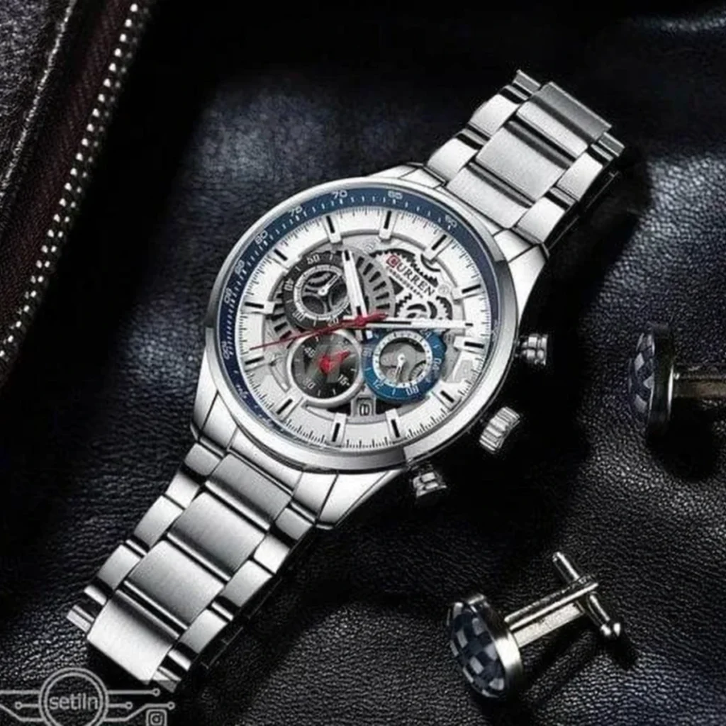 Montre Homme CURREN 8391 Chronographe – Cadran Argenté Ajouré, Lunette Bleue, Acier